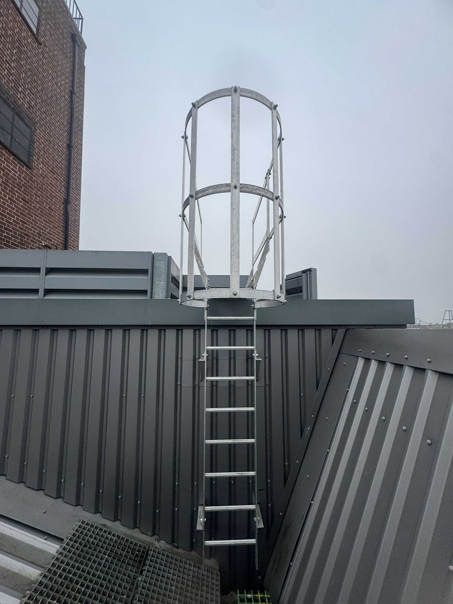 Fixed Access Ladder Installation — Sky Height Safety engineers on site, working to BS EN ISO 14122-4, BS 4211, BS 5395-1